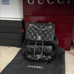 Chanel Black Quilted Backpack with Gold Accents